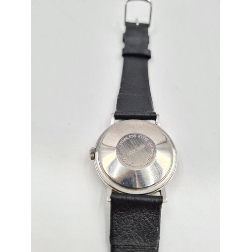 164 - A vintage Smiths Astral hand wind gents wristwatch with silvered dial and black strap - made in Engl... 