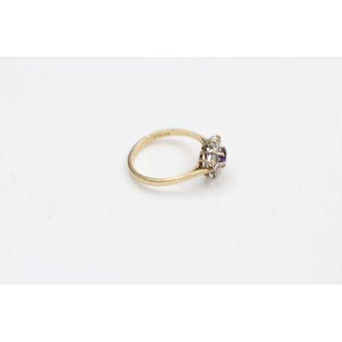 11 - A hallmarked London 9ct gold gemstone cluster dress ring with central amethyst, size N  - approx. gr... 