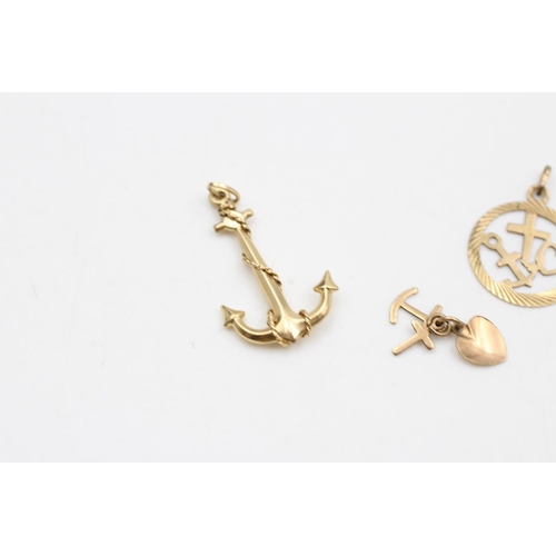 21 - Three pieces of 9ct gold jewellery, two pendants and one charm - approx. gross weight 2.4 grams