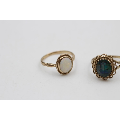 39 - Two 9ct gold opal solitaire dress rings, one size O and one size P - approx. gross weight 4.4 grams