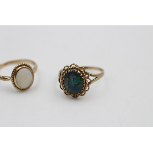 39 - Two 9ct gold opal solitaire dress rings, one size O and one size P - approx. gross weight 4.4 grams