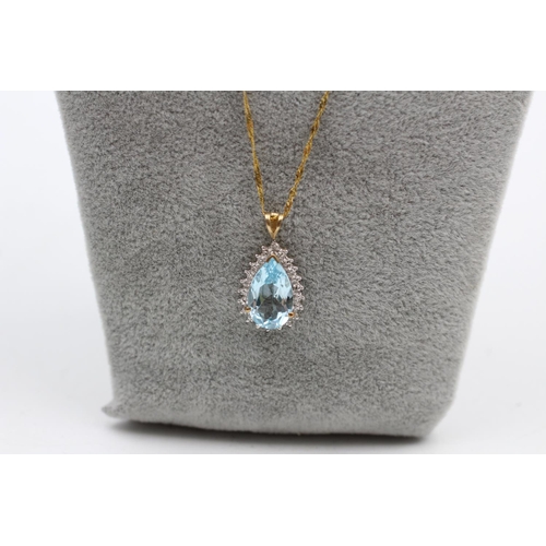 40 - A 9ct gold pear shaped topaz cluster pendant chain necklace - approx. gross weight 3.3 grams