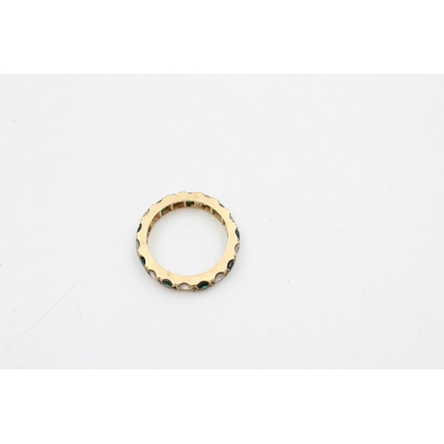 41 - A 9ct gold composite green & clear stones eternity ring, size K ½ - approx. gross weight 3 grams