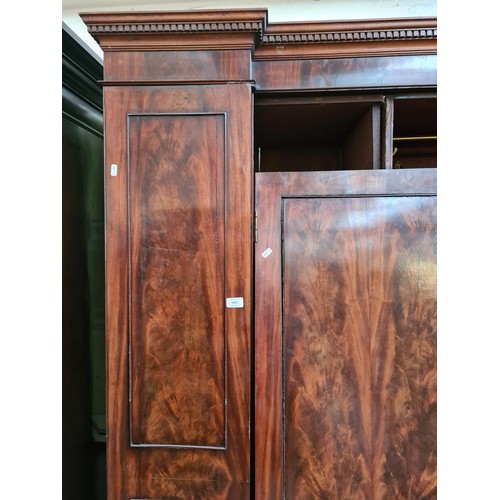 1002A - A George III mahogany double wardrobe - approx. 215cm high x 187cm wide x 57cm deep