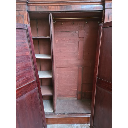 1002A - A George III mahogany double wardrobe - approx. 215cm high x 187cm wide x 57cm deep