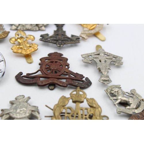 102 - Fifteen assorted vintage military cap badges to include Scottish, Suffolk, West Riding etc.