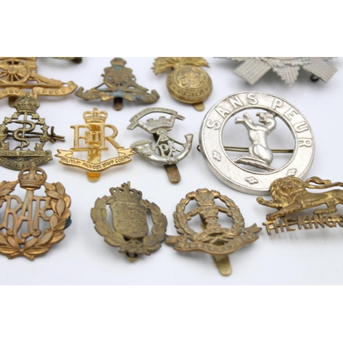 107 - Fifteen assorted vintage military cap badges to include Scottish, A.T.S, Prince Albert's etc.