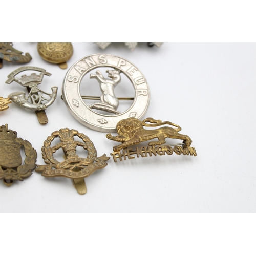 107 - Fifteen assorted vintage military cap badges to include Scottish, A.T.S, Prince Albert's etc.