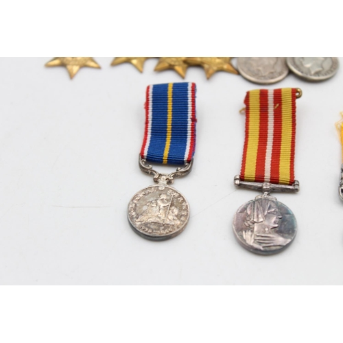 108 - A collection of miniature medals to include mounted WWII groups, National Service etc.