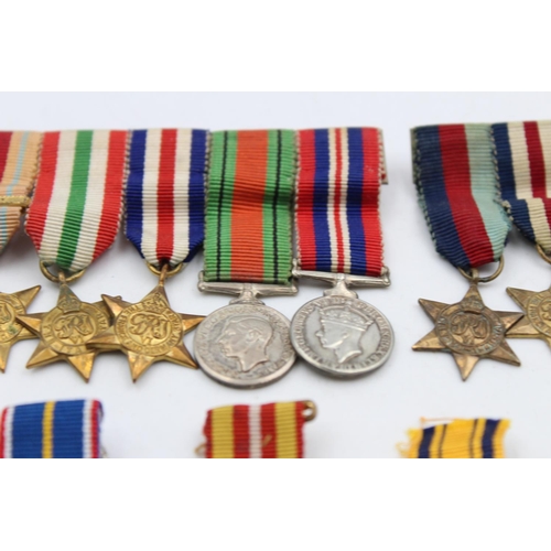 108 - A collection of miniature medals to include mounted WWII groups, National Service etc.