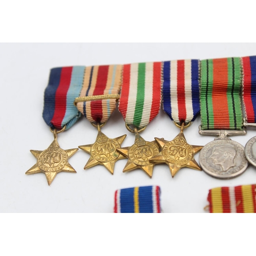 108 - A collection of miniature medals to include mounted WWII groups, National Service etc.