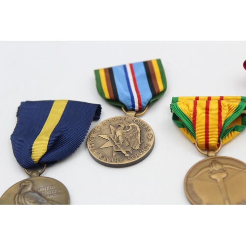 112 - Six assorted vintage American military medals to include Purple Heart, WWII etc.