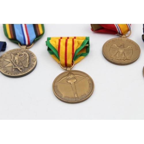 112 - Six assorted vintage American military medals to include Purple Heart, WWII etc.