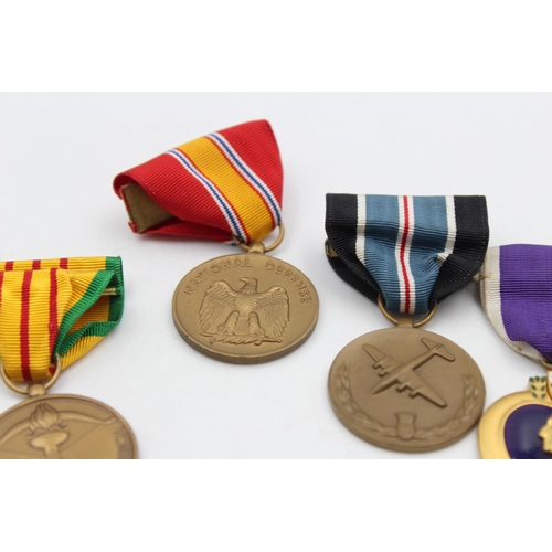 112 - Six assorted vintage American military medals to include Purple Heart, WWII etc.