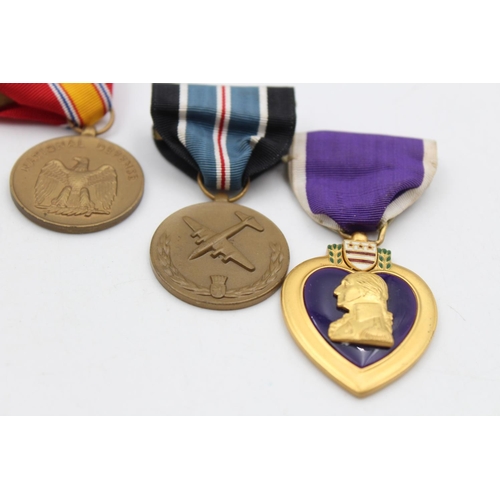 112 - Six assorted vintage American military medals to include Purple Heart, WWII etc.