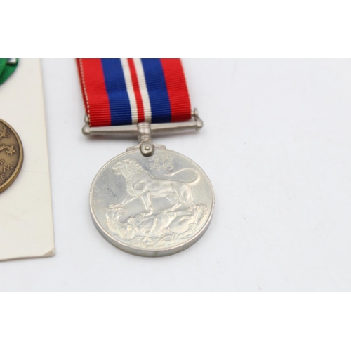 114 - Four assorted vintage medals to include boxed Women's Voluntary Service, Vietnam Service, George VI ... 