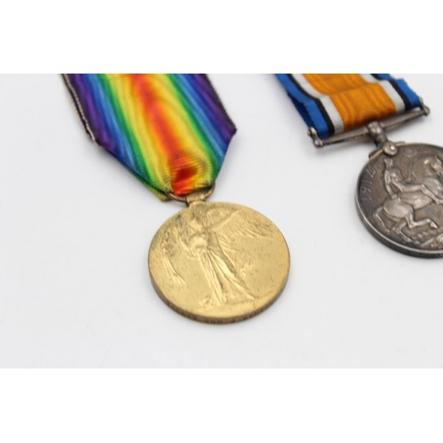 115 - A WWI medal pair with original ribbons presented to 715812 Gnr. J. Kenyon R.A