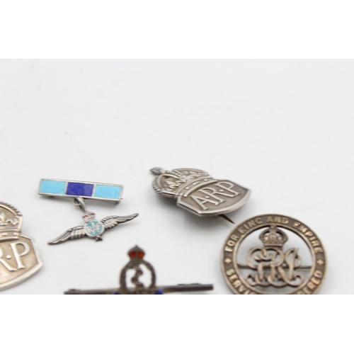 119 - Seven vintage stamped .925 silver military/A.R.P badges to include War badge, no. 77551 - approx. gr... 