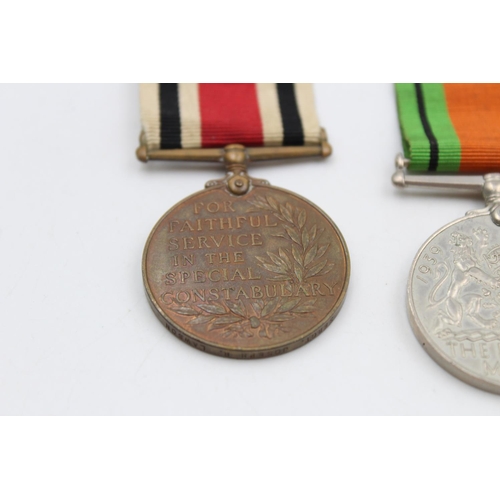 121 - Three various medals, George V Police medal presented to Sergt. Joseph R. Lawson, The Defence medal ... 