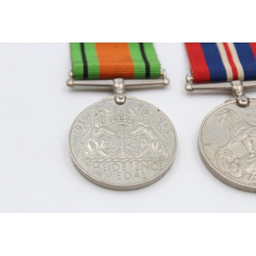 121 - Three various medals, George V Police medal presented to Sergt. Joseph R. Lawson, The Defence medal ... 