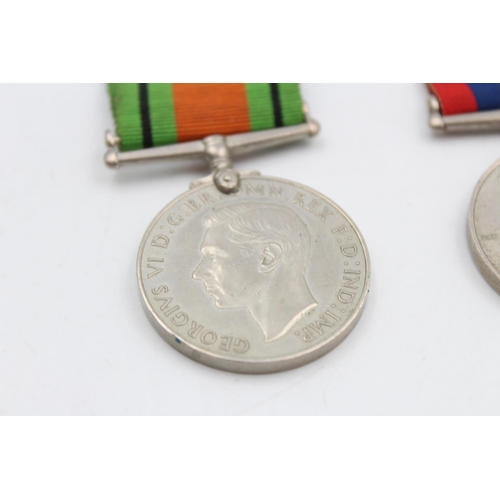 121 - Three various medals, George V Police medal presented to Sergt. Joseph R. Lawson, The Defence medal ... 