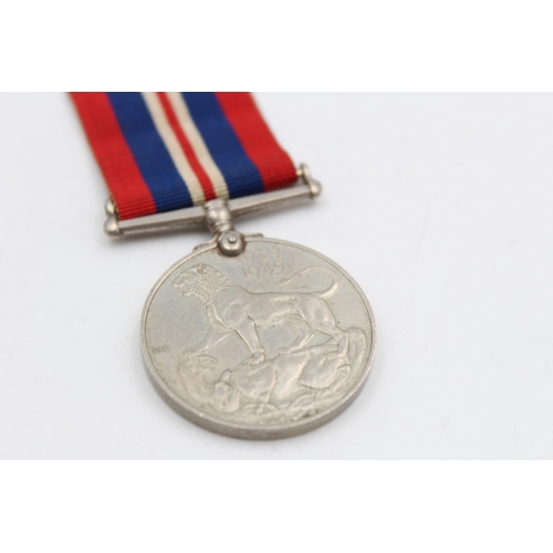 121 - Three various medals, George V Police medal presented to Sergt. Joseph R. Lawson, The Defence medal ... 