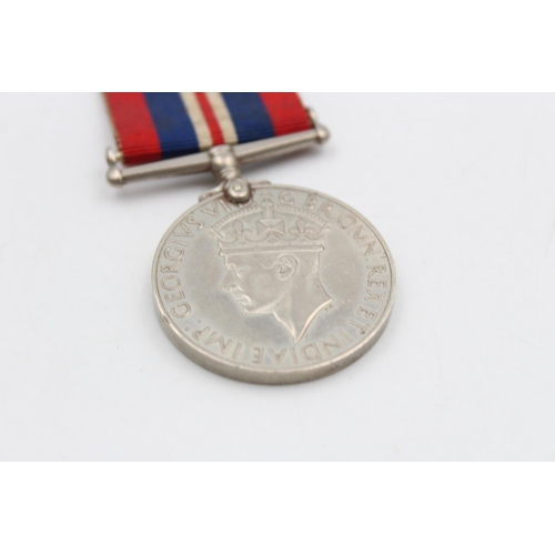 121 - Three various medals, George V Police medal presented to Sergt. Joseph R. Lawson, The Defence medal ... 