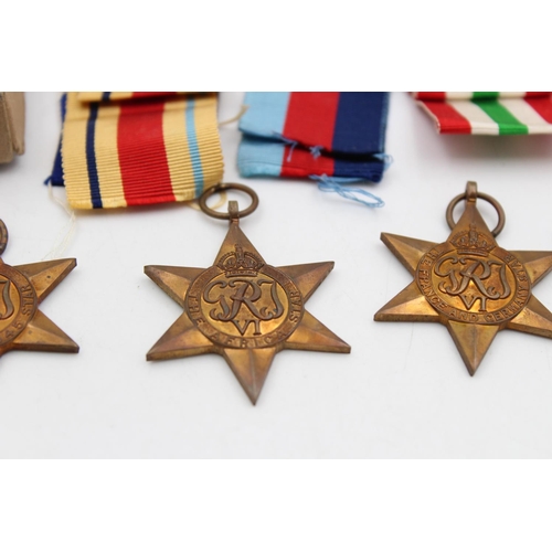 125 - A boxed WWII medal group with award note and packets to include The Africa Star, War Medal 1939-1945... 