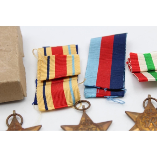 125 - A boxed WWII medal group with award note and packets to include The Africa Star, War Medal 1939-1945... 