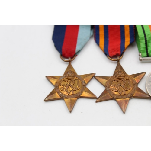 126 - Four WWII mounted medals awarded to Capt. G. C. Cooke to include The Defence Medal, The Burma Star, ... 