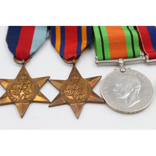 126 - Four WWII mounted medals awarded to Capt. G. C. Cooke to include The Defence Medal, The Burma Star, ... 