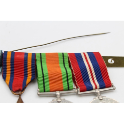 126 - Four WWII mounted medals awarded to Capt. G. C. Cooke to include The Defence Medal, The Burma Star, ... 