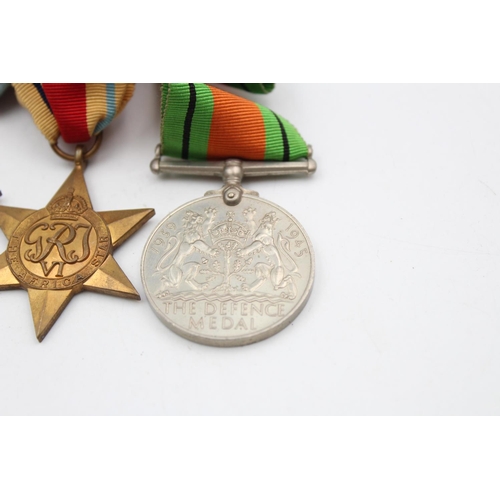 129 - Four assorted medals, three WWII mounted medals comprising The 1939-1945 Star, The Africa Star and T... 