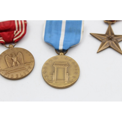 130 - Seven assorted vintage American military medals to include WWII, Bronze Star etc.