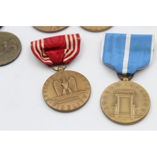 130 - Seven assorted vintage American military medals to include WWII, Bronze Star etc.