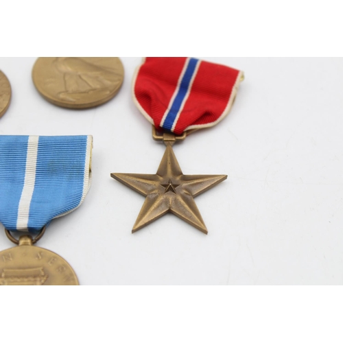 130 - Seven assorted vintage American military medals to include WWII, Bronze Star etc.