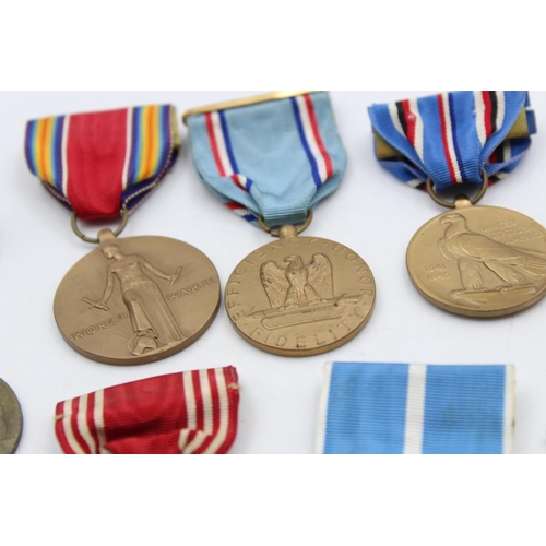 130 - Seven assorted vintage American military medals to include WWII, Bronze Star etc.