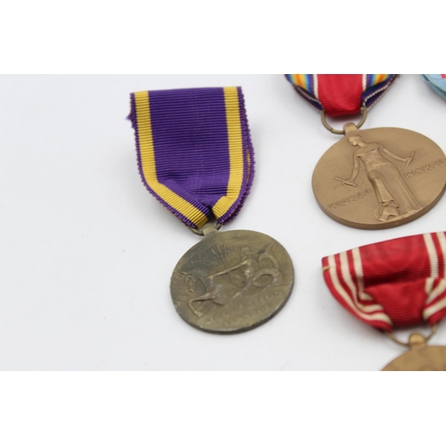 130 - Seven assorted vintage American military medals to include WWII, Bronze Star etc.