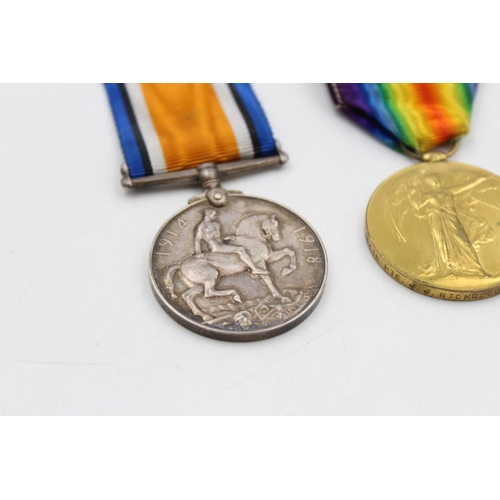 140 - A WWI medal pair with original ribbons awarded to 36418 Pte. J.J Nicolson - East Surrey Regiment