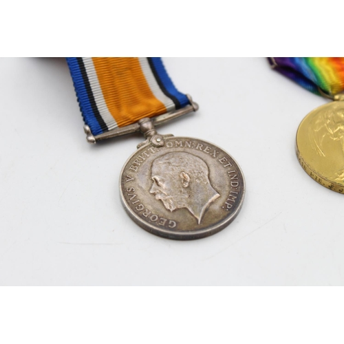 140 - A WWI medal pair with original ribbons awarded to 36418 Pte. J.J Nicolson - East Surrey Regiment