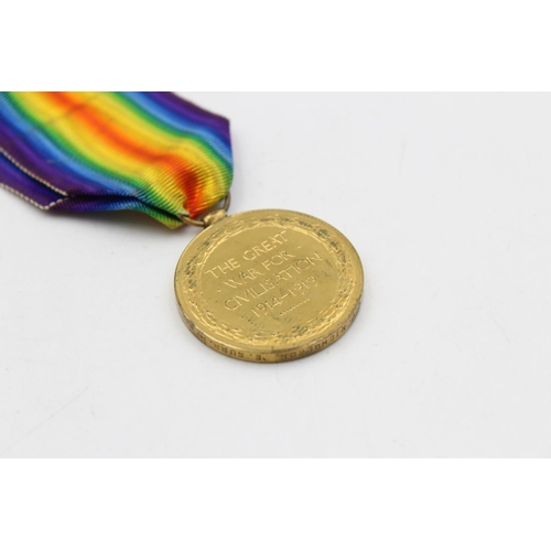 140 - A WWI medal pair with original ribbons awarded to 36418 Pte. J.J Nicolson - East Surrey Regiment