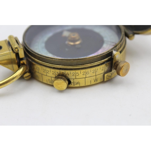 143 - A WWI British brass military compass with makers mark F-L, numbered 112031 and dated 1917 - approx. ... 