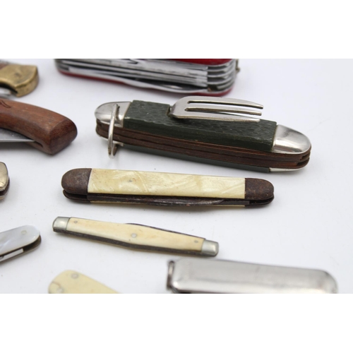 153 - Twelve assorted vintage pocket knives to include Swiss army etc.