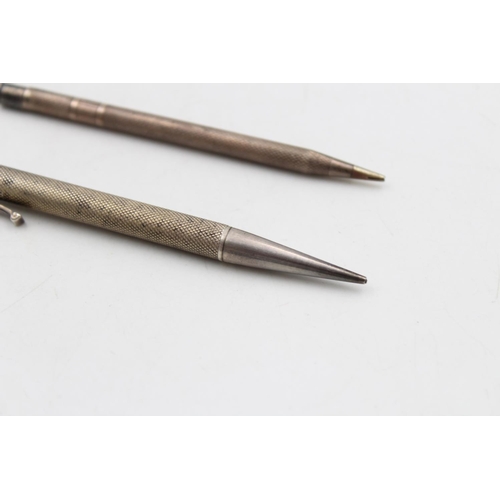 173 - Two hallmarked silver pencils - approx. combined gross weight 37 grams