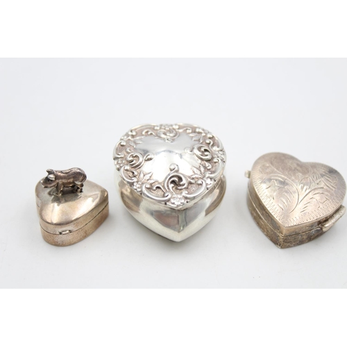 176 - Three sterling silver heart shaped pill/trinket boxes, two being hallmarked and one stamped .925 - a... 