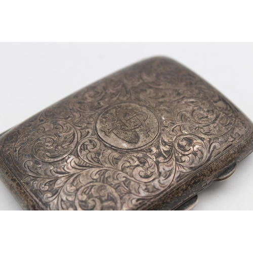 185 - A hallmarked Birmingham silver cigarette case with cartouche and scrolled leaf engravings by J Colly... 