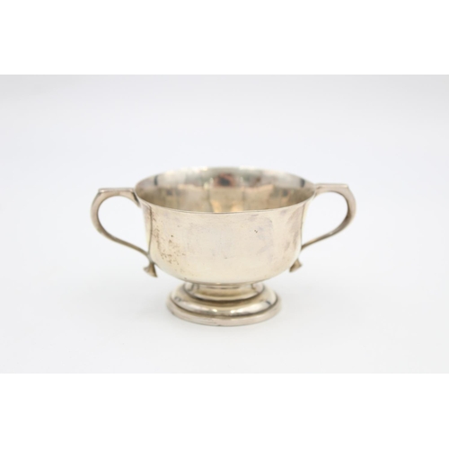 200 - A hallmarked Sheffield silver 5cm twin handled cup, dated 1939 - approx. gross weight 55 grams