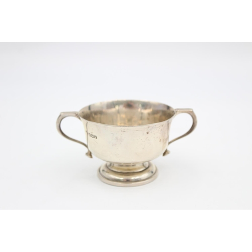 200 - A hallmarked Sheffield silver 5cm twin handled cup, dated 1939 - approx. gross weight 55 grams