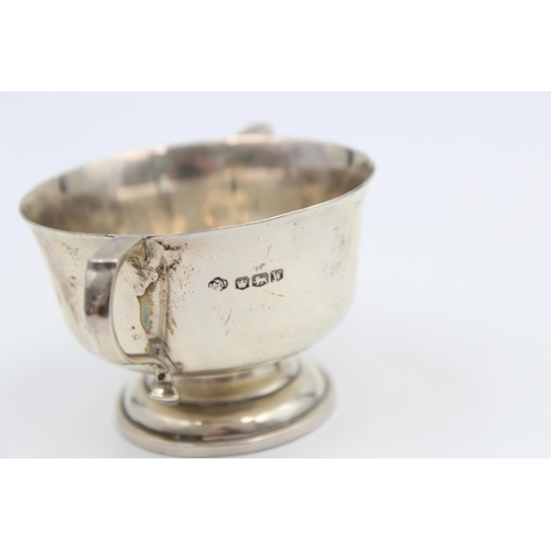 200 - A hallmarked Sheffield silver 5cm twin handled cup, dated 1939 - approx. gross weight 55 grams