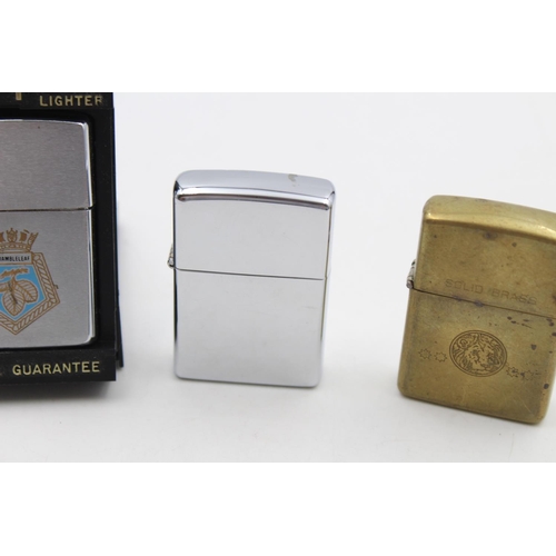 213 - Three assorted Zippo cigarette lighters